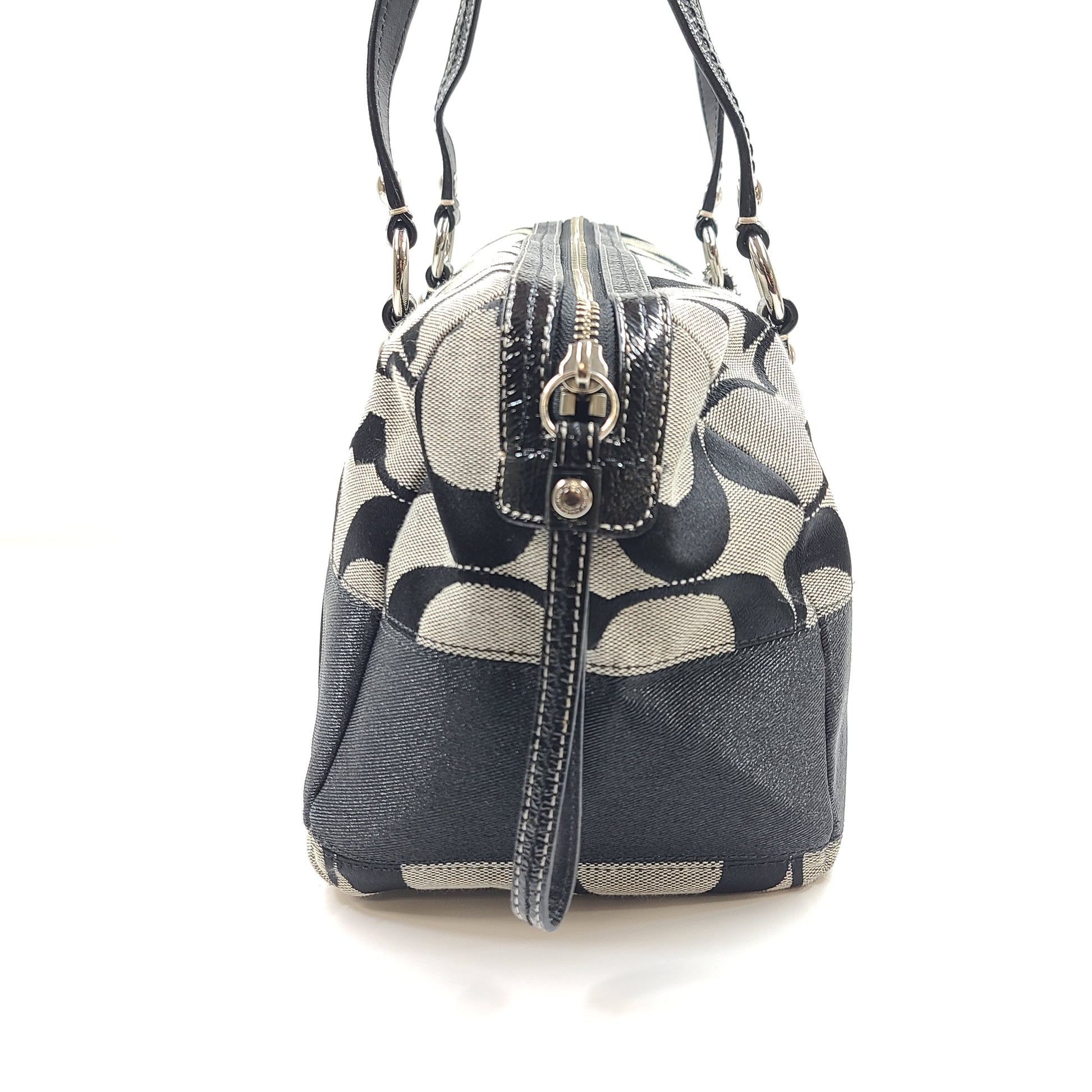 Gray and black Coach satchel with double handles, zip closure, and an interior patch stating handcrafted Coach leather.