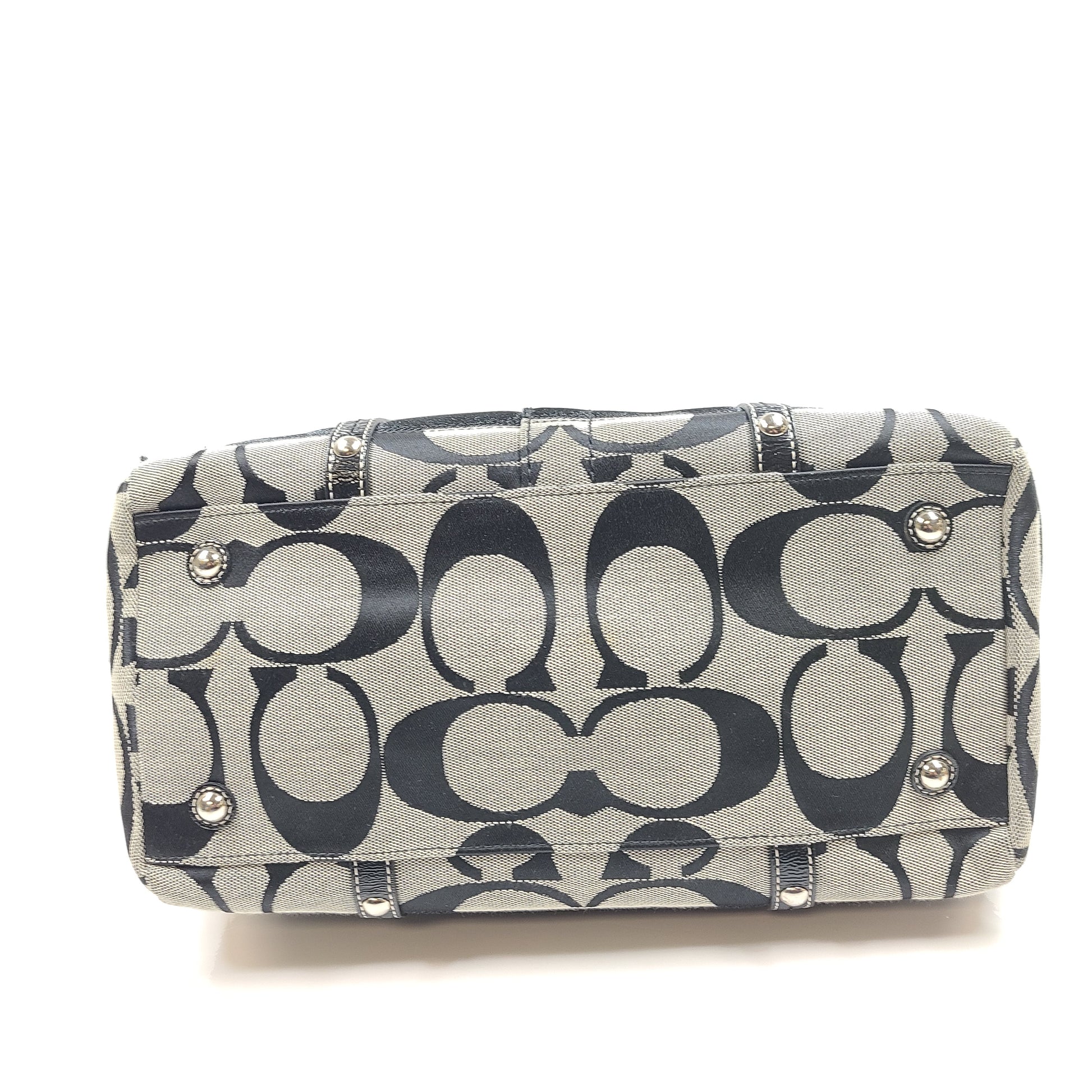 Gray and black Coach satchel with double handles, zip closure, and an interior patch stating handcrafted Coach leather.