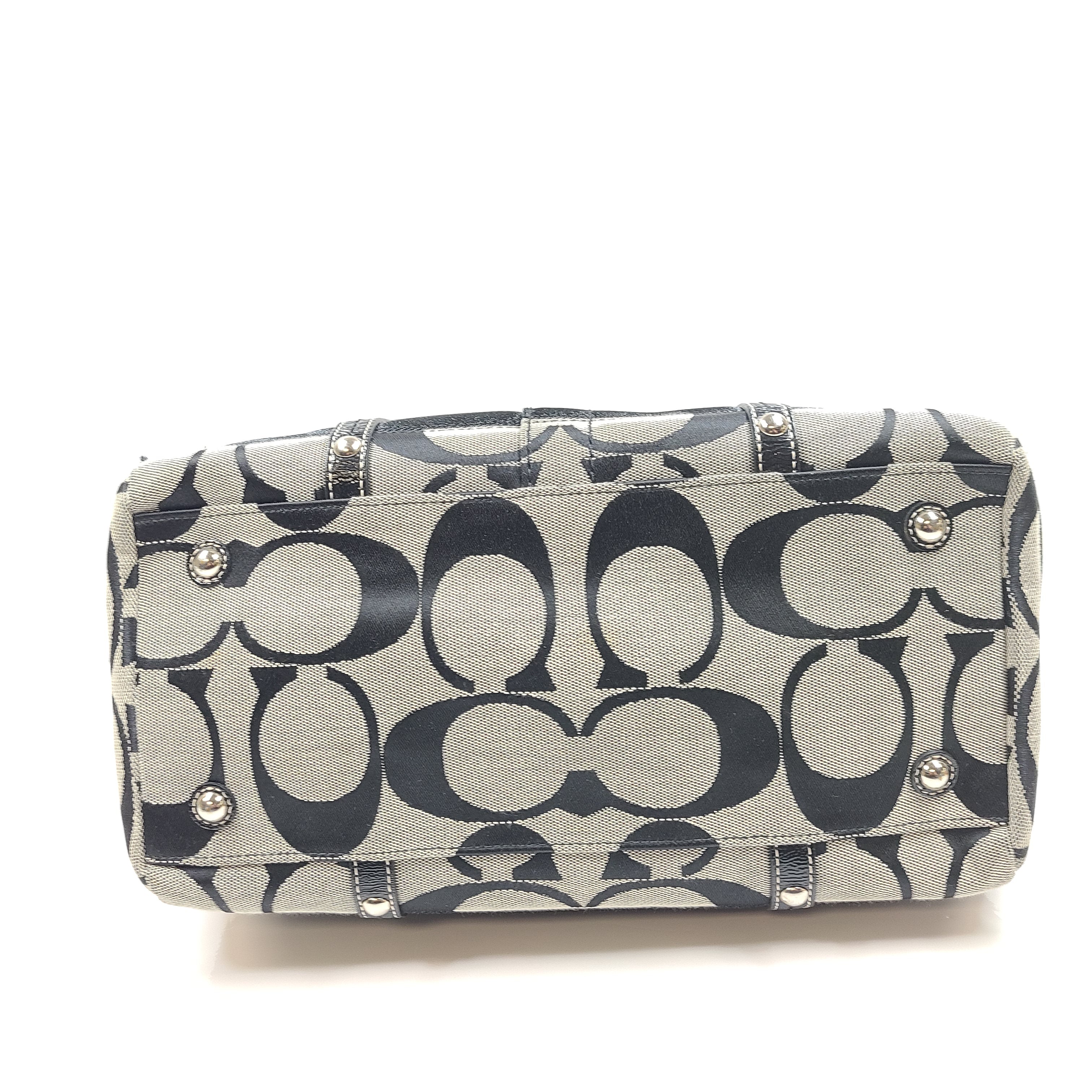 Gray and black Coach satchel with double handles, zip closure, and an interior patch stating handcrafted Coach leather.