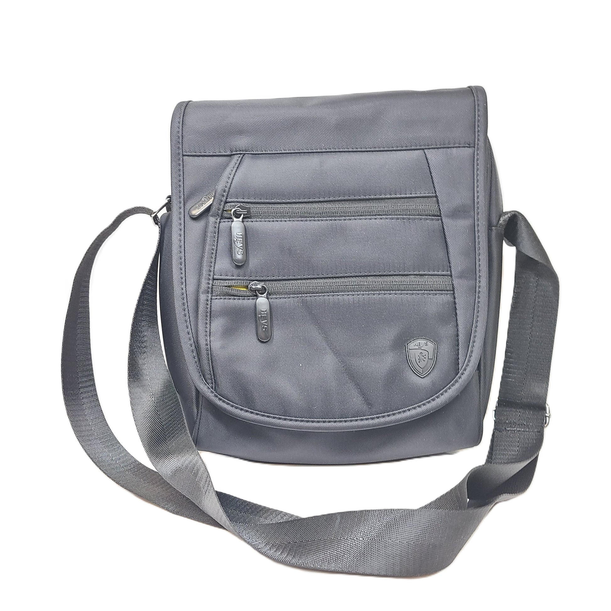 Compact black RFID-shield crossbody messenger bag with magnetic front flap for secure everyday carry.