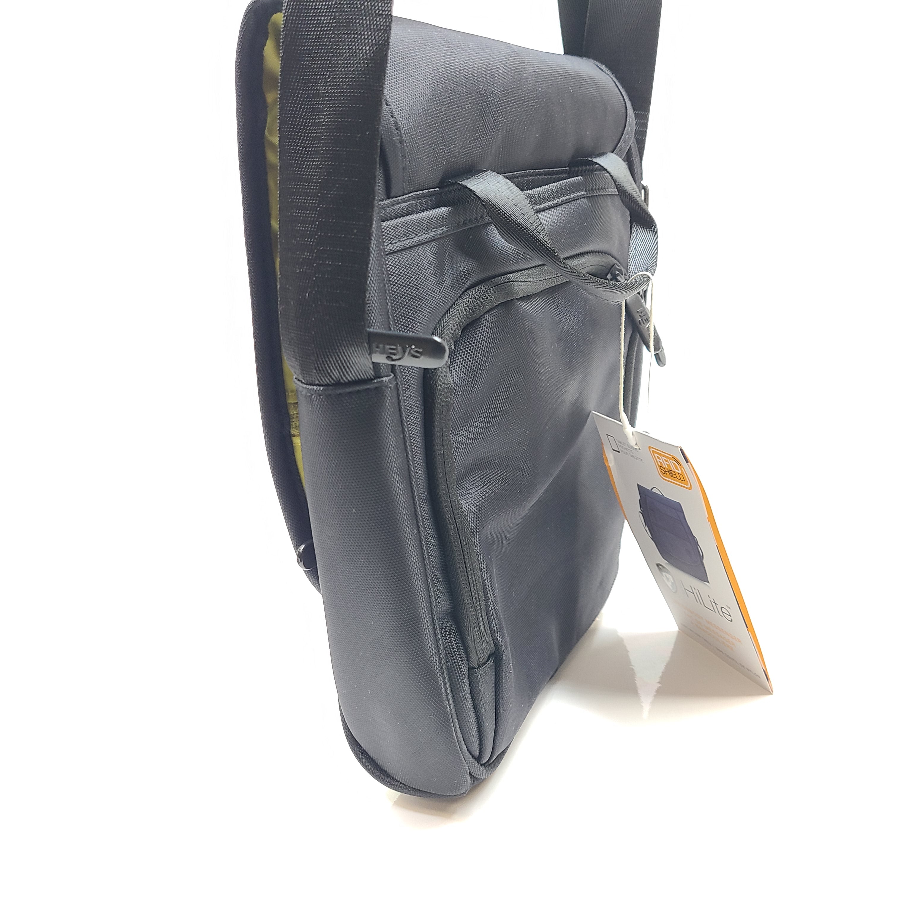 Compact black RFID-shield crossbody messenger bag with magnetic front flap for secure everyday carry.