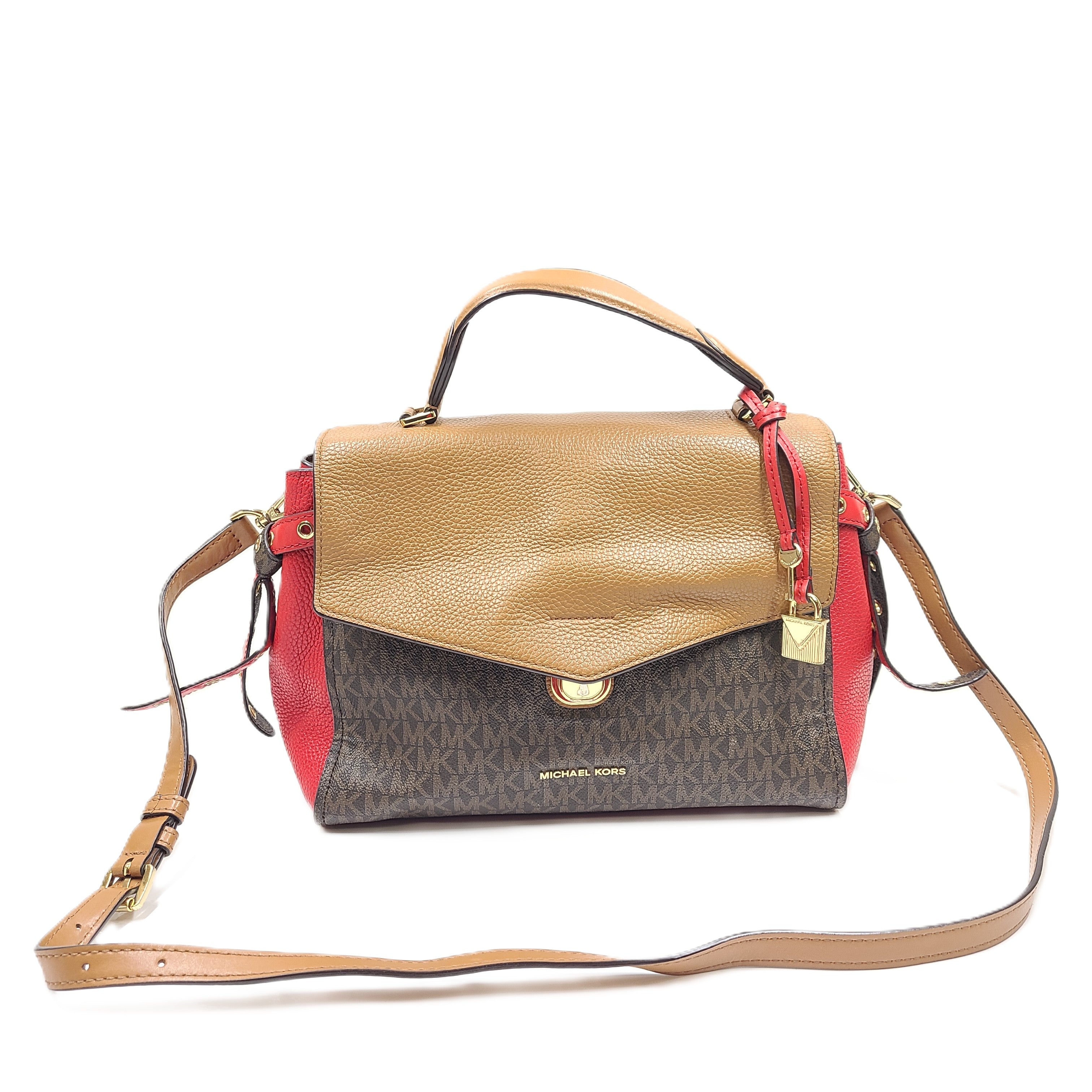 Brown and red Michael Kors handbag with detachable strap and logo buckle.