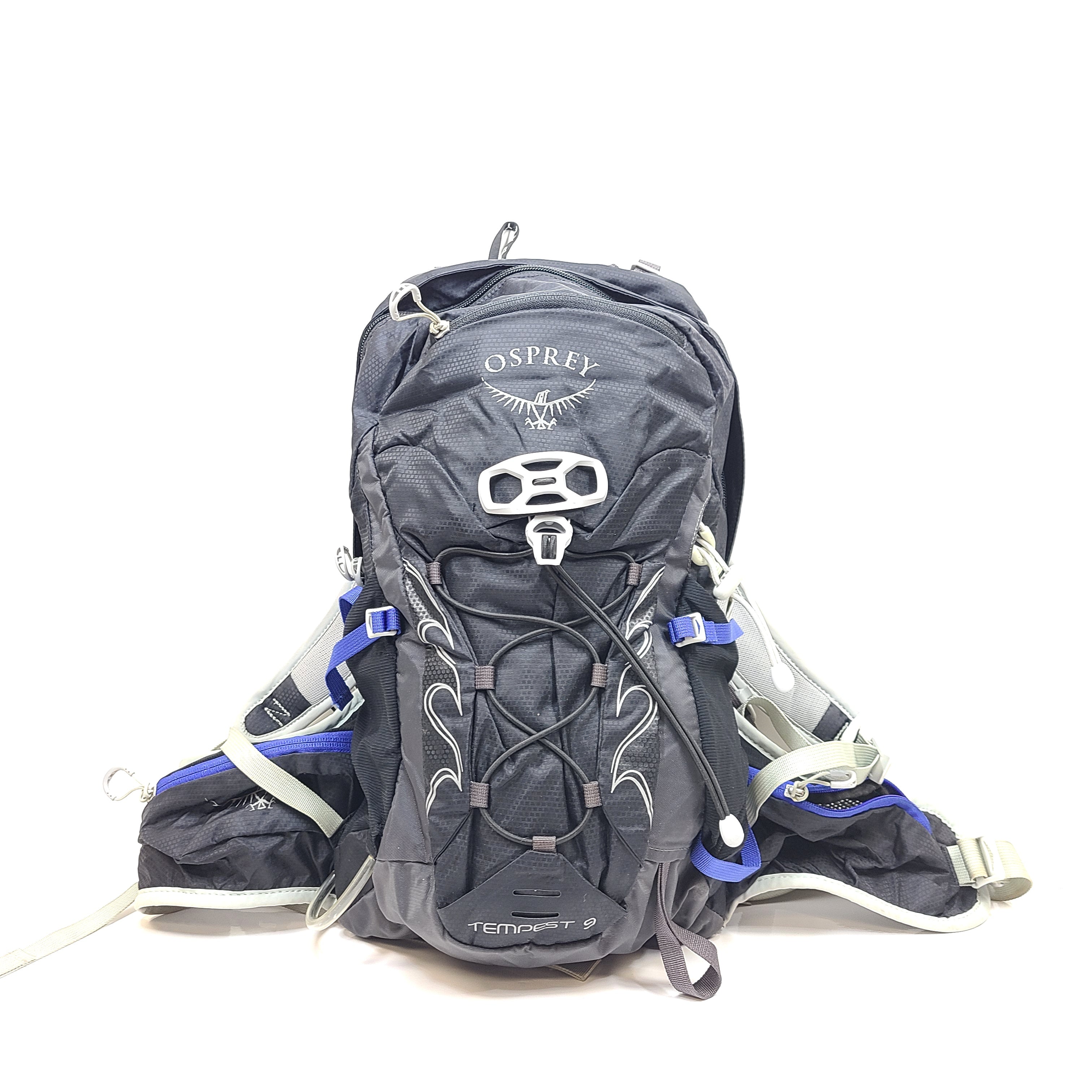 Compact Osprey Tempest 9 backpack in black, blue, and grey with Airscape back panel and adjustable straps for comfortable carry.