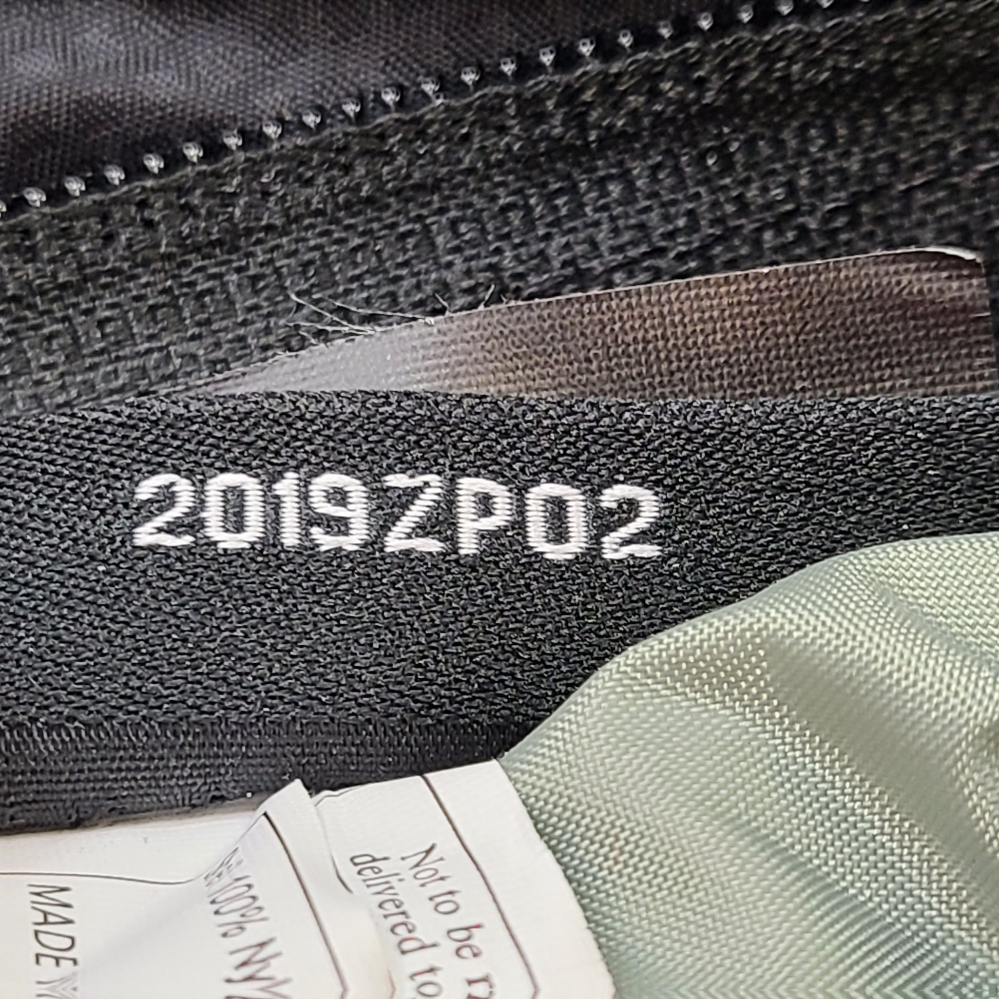 Compact Osprey Tempest 9 backpack in black, blue, and grey with Airscape back panel and adjustable straps for comfortable carry.