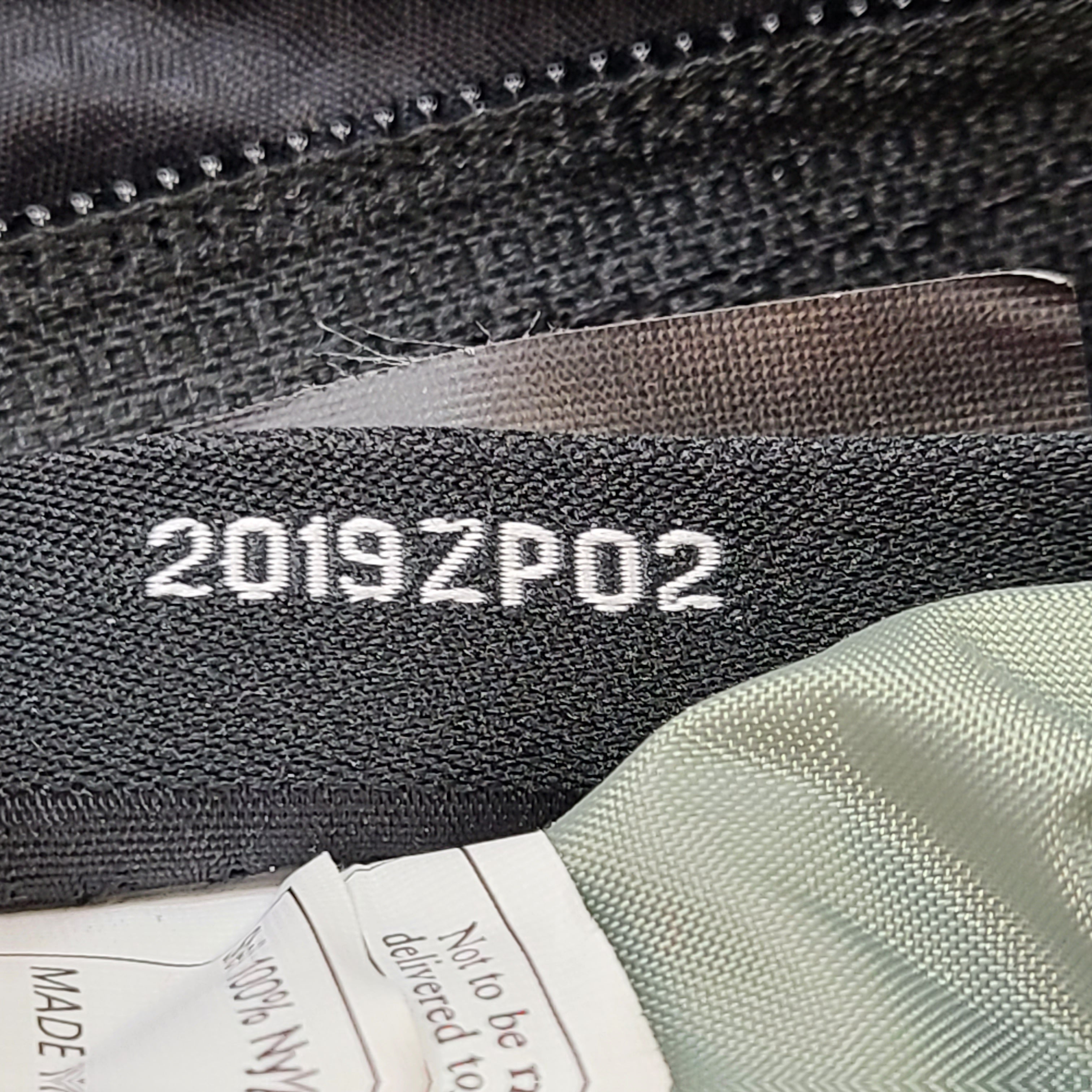 Compact Osprey Tempest 9 backpack in black, blue, and grey with Airscape back panel and adjustable straps for comfortable carry.