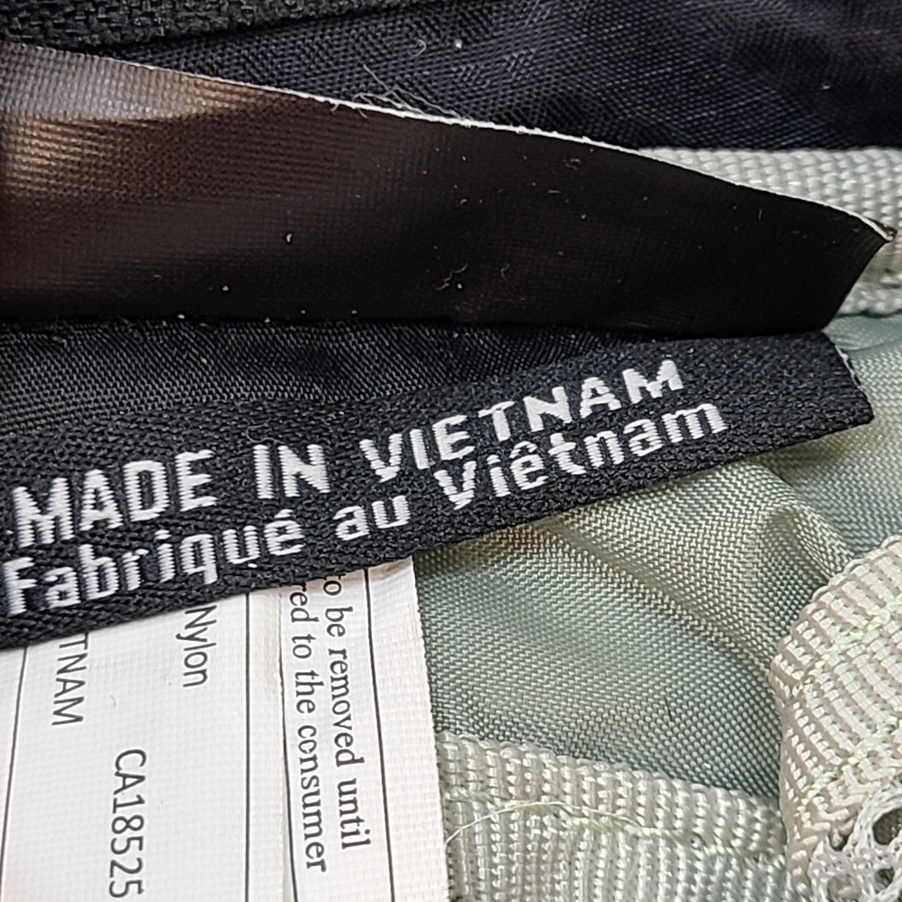 Compact Osprey Tempest 9 backpack in black, blue, and grey with Airscape back panel and adjustable straps for comfortable carry.