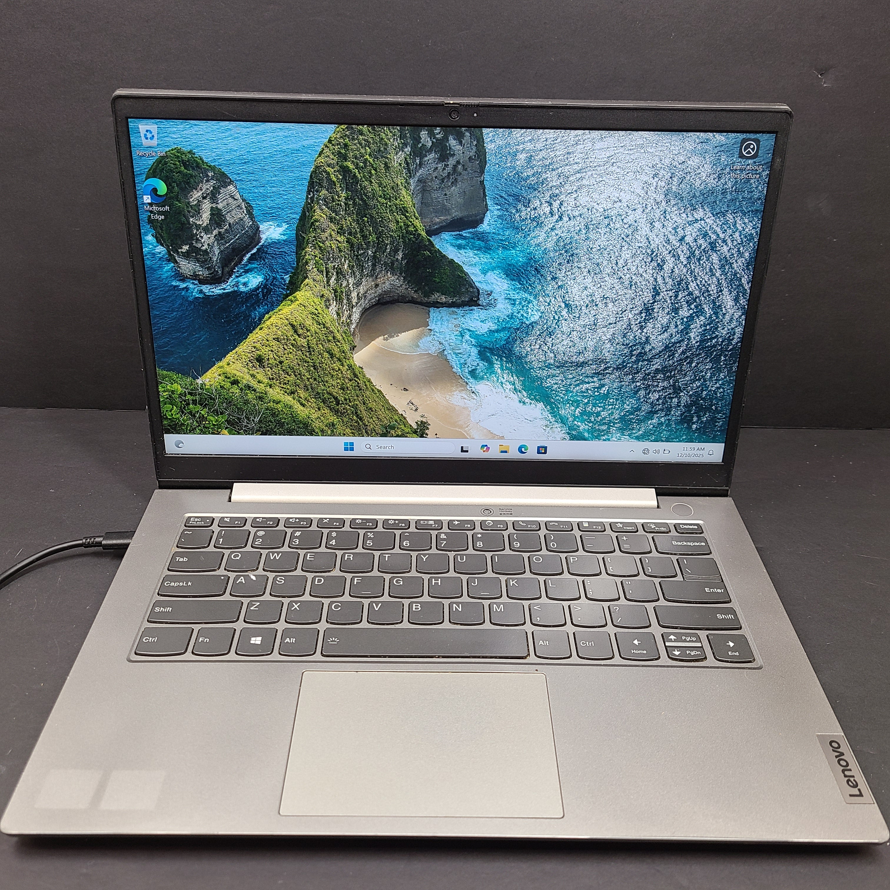 Silver Lenovo ThinkBook with AMD Ryzen 5 and 8GB RAM designed for reliable everyday productivity.