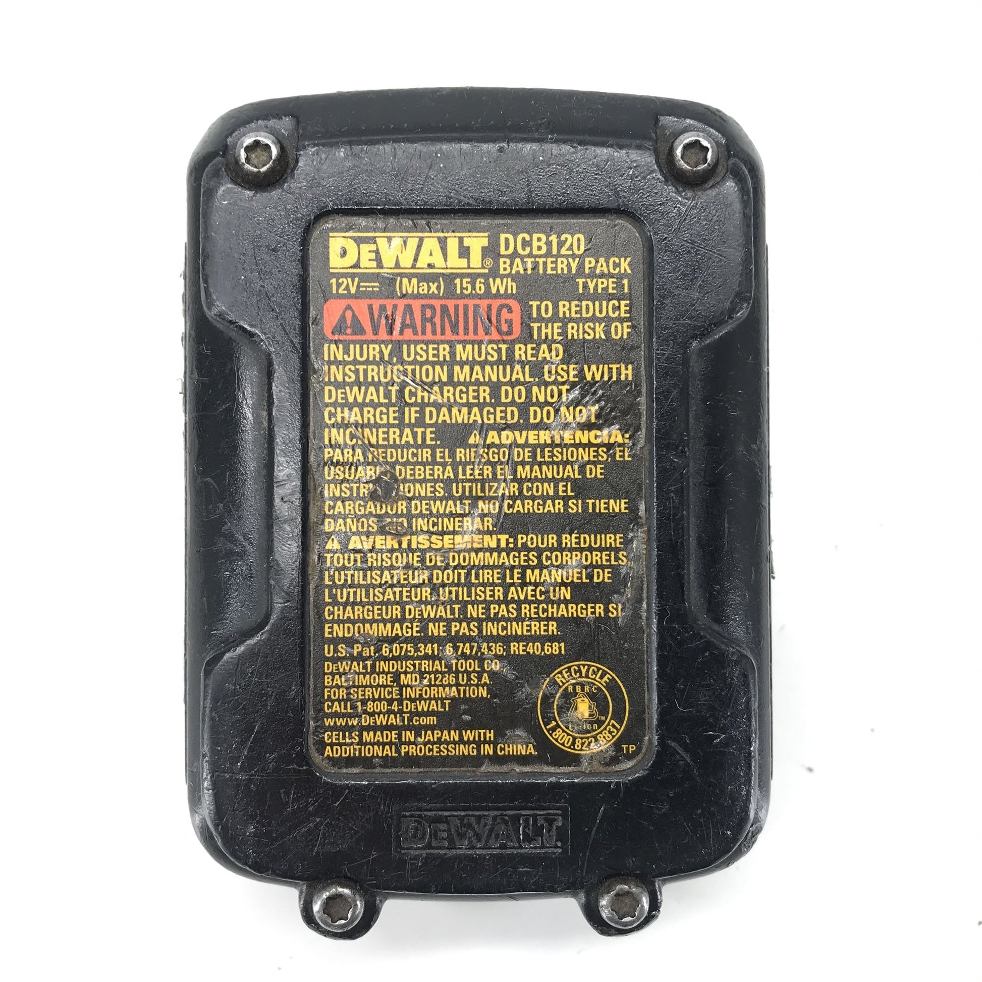 DeWalt battery pack with warning label on a white background