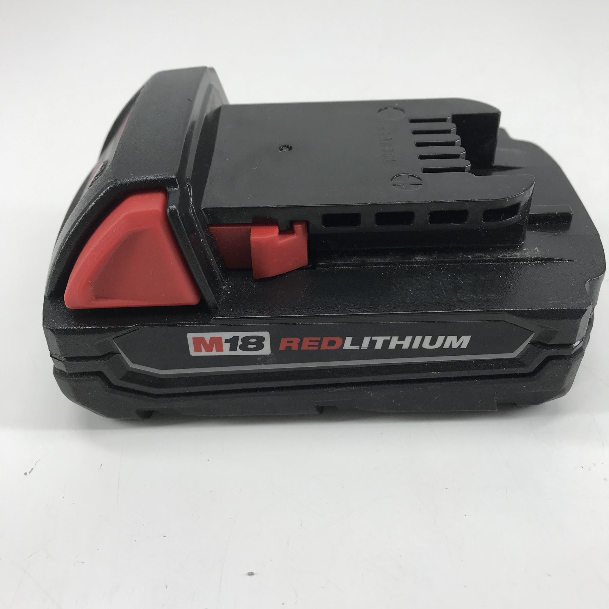 Black and red M18 RedLithium battery on a white background